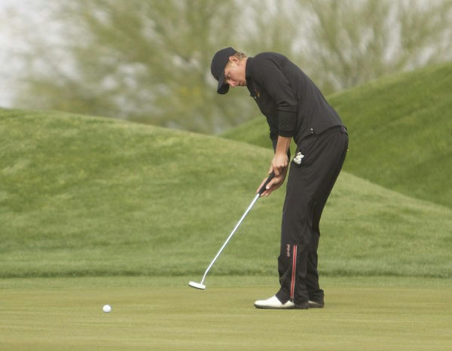 Conference Title Dreams: ASU senior Scott Pinckney lays out a putt at ASU Thunderbird Invitational on April 9. The Sun Devils will have one of the deepest rosters at the Pac-10 Championships, hosted by Stanford, on Friday. (Photo by Scott Stuk)
