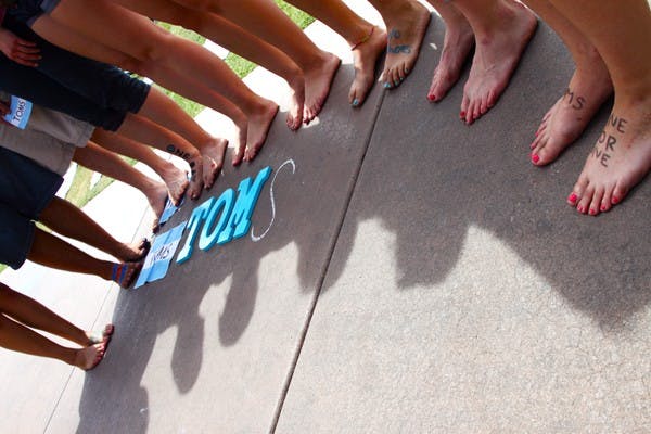 HELPLESS HEELS: Dozens of students participated in "ONE DAY WITHOUT SHOES", supported by Tom's Shoes, to raise awareness for people in need of shoes in other countries. (Photo by Rosie Gochnour)