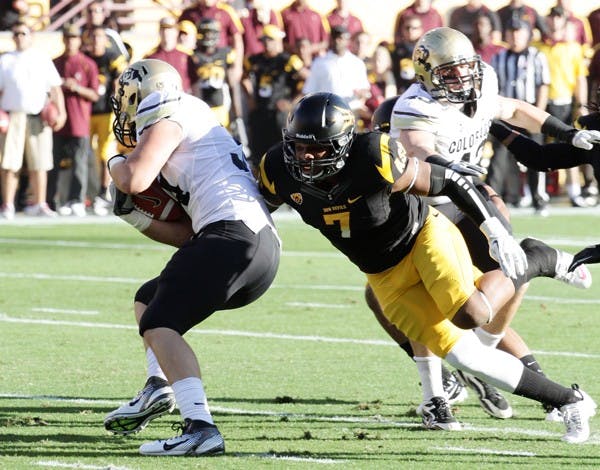 FAVORED: ASU junior linebacker Vontaze Burfict reaches for Colorado senior tight end Ryan Deehan during the Sun Devils’ 48-14 win on Saturday. Despite equal Pac-12 records, ASU holds a significant advantage against UCLA. (Photo by Elijah Grasser)