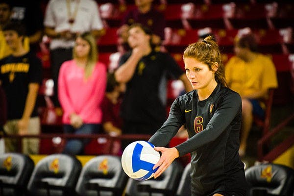 Senior libero Stephanie Preach looking focused before serving during the 3rd and final set, 25-14.