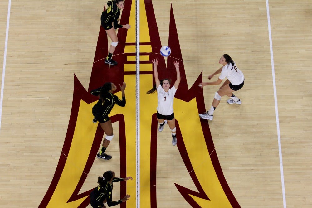 Sophomore Bianca Arellano sets the ball for Sophomore Whitney Follette during their match against Oregon. The Sun Devils lost 1-3. (Photo by Diana Lustig)