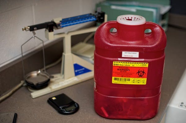 DRUG DROP:  Expired prescription drugs are labeled and prepared for destruction by incineration. On Saturday afternoon, the Tempe police department, in conjunction with the DEA, took part in a nationwide prescription drug-drop effort, where people could anonymously leave their expired prescription drugs at the police station. (Photo by Michael Arellano)