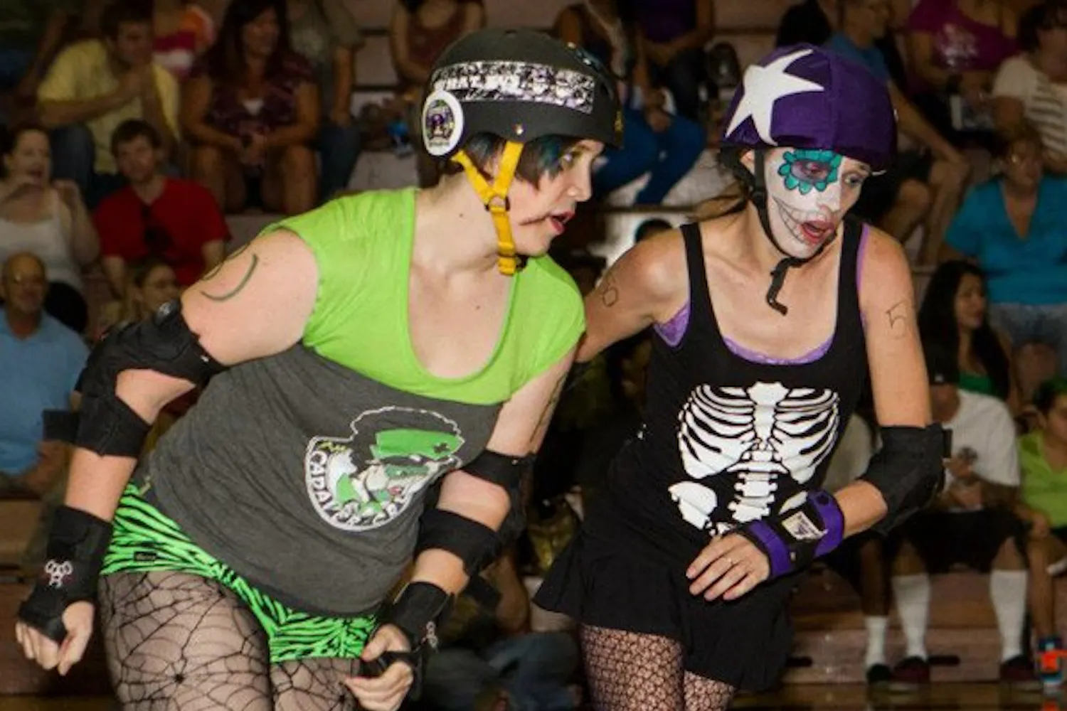 Geology major Sarah Gray attempts to block Lolitas de los Muertos' Jammer Allie Bye from scoring a point at a match in August. (Photo courtesy of Devon Cadams)