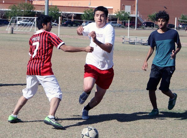 ASUlympics participants play a game of soccer on the Student Recreation Center fields on the Tempe campus. (Photo by Jessie Wardarski)