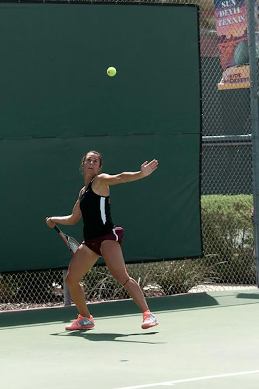 Stephanie Vlad volleys the ball over the net during a match against Cal’s Klara Fabikova on Sunday, November 10, 2013. Vlad finished third at this years, ASU Thunderbird Invitational at the Whiteman Tennis Center. (Photo by Murphy Bannerman)