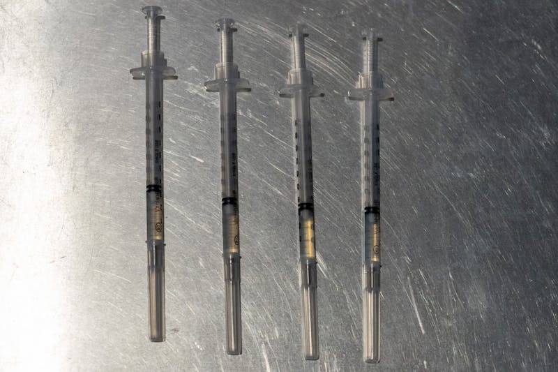 Four syringes containing the Pfizer COVID-19 vaccine are shown in the Desert Financial Arena vaccine site in Tempe on Wednesday, May 19, 2021.