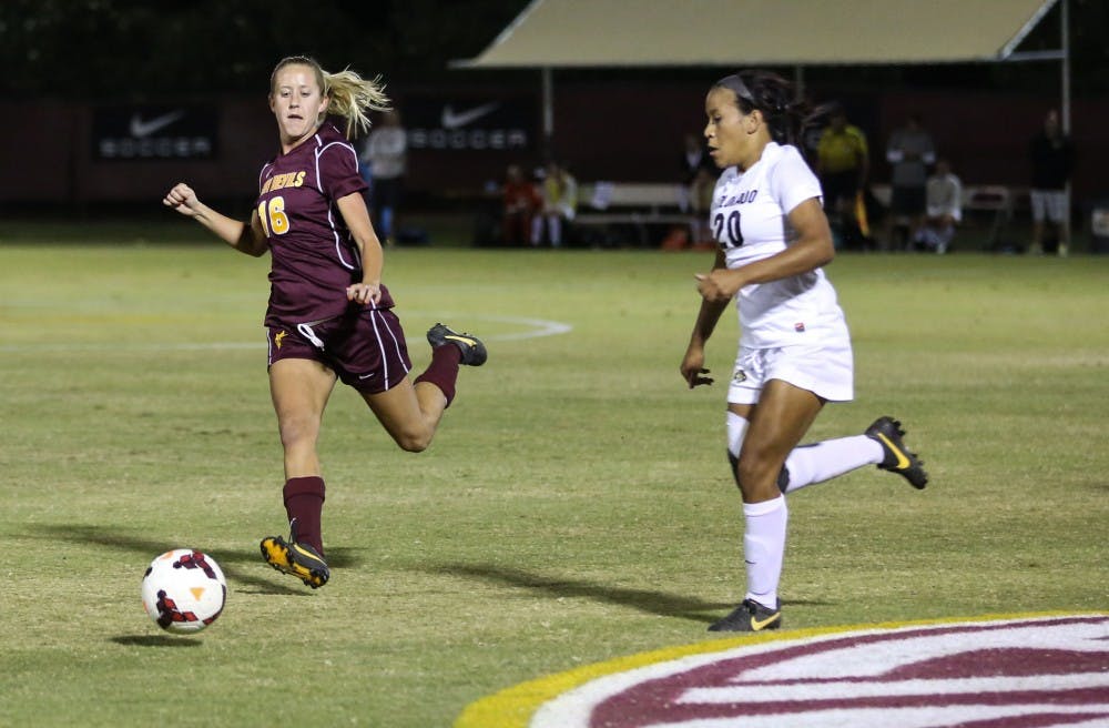 Senior midfield Blair Alderson keeps the ball away from Colorado during the game Friday in Tempe. The ASU women’s soccer team is playing UA on Thursday and is hoping to continue on to an NCAA tournament in the future. (Photo by Arianna Grainey)