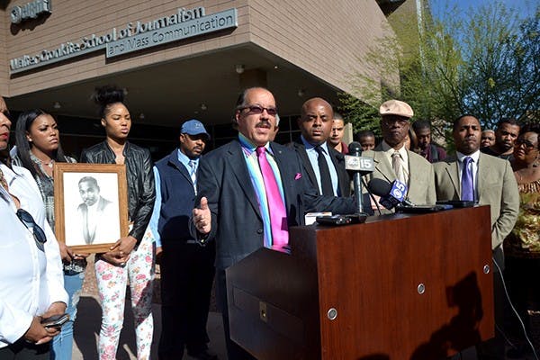 Rev. Luther Holland of the First Institution Baptist speaks at a civil rights protest outside of the Walter Cronkite School of Journalism and Mass Communication on Tuesday. Civil rights leaders gathered to protest a party hosted by the Tau Kappa Epsilon that featured racist stereotypes. (Photo by Rachel Nemeh)