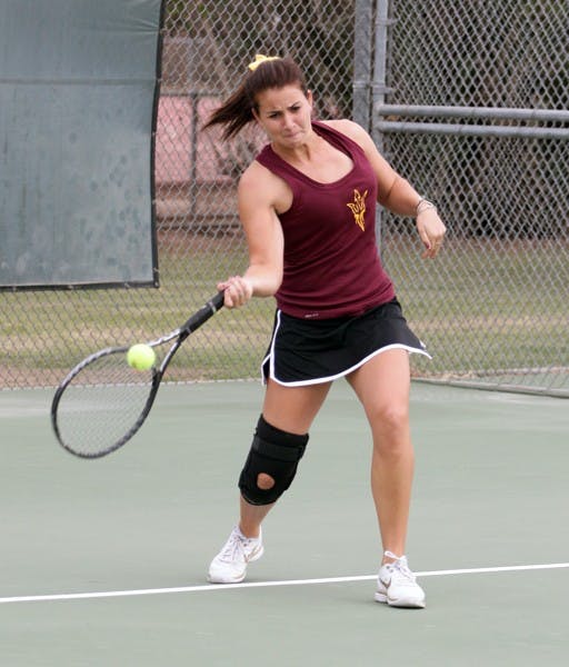 Junior Nicole Smith forehands the ball at the ASU Thunderbird Invitational on Nov. 4, 2011. Smith, who has battled injuries this season, led the Sun Devils to a win over Texas Tech. (Photo by Beth Easterbrook)