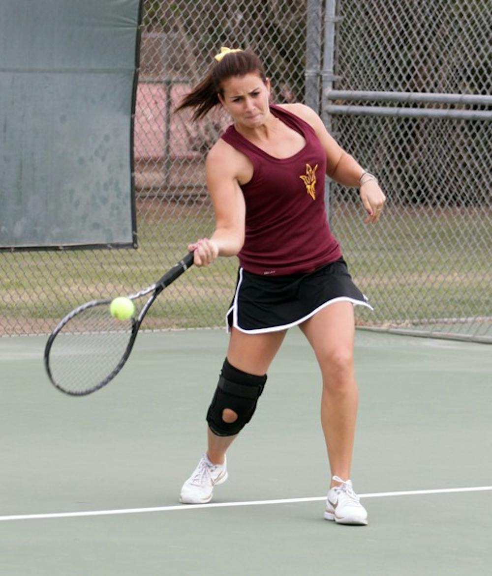 Junior Nicole Smith forehands the ball at the ASU Thunderbird Invitational on Nov. 4, 2011. Smith, who has battled injuries this season, led the Sun Devils to a win over Texas Tech. (Photo by Beth Easterbrook)