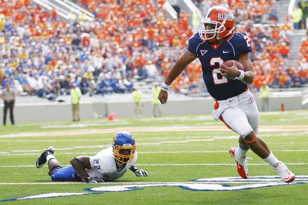 Daryl Quitalig The Daily IlliniIlinois' Nathan Scheelhaase (2) runs past  South Dakota State's Anthony Wise (22)  at the game at Memorial Stadium. In this Saturday, September 10, 2011 game, the Illini won 56-3.