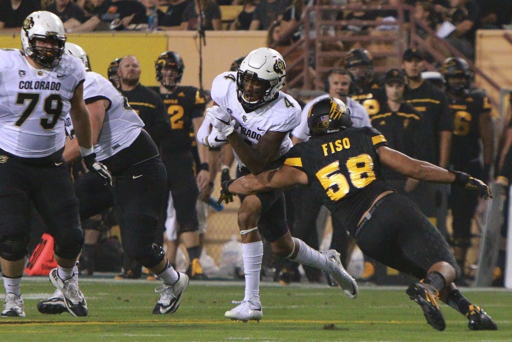 Redshirt junior linebacker Salamo Fiso (58) tackles the ball carrier in the first quarter against Colorado on Saturday, Oct. 10, 2015, at Sun Devil Stadium in Tempe.