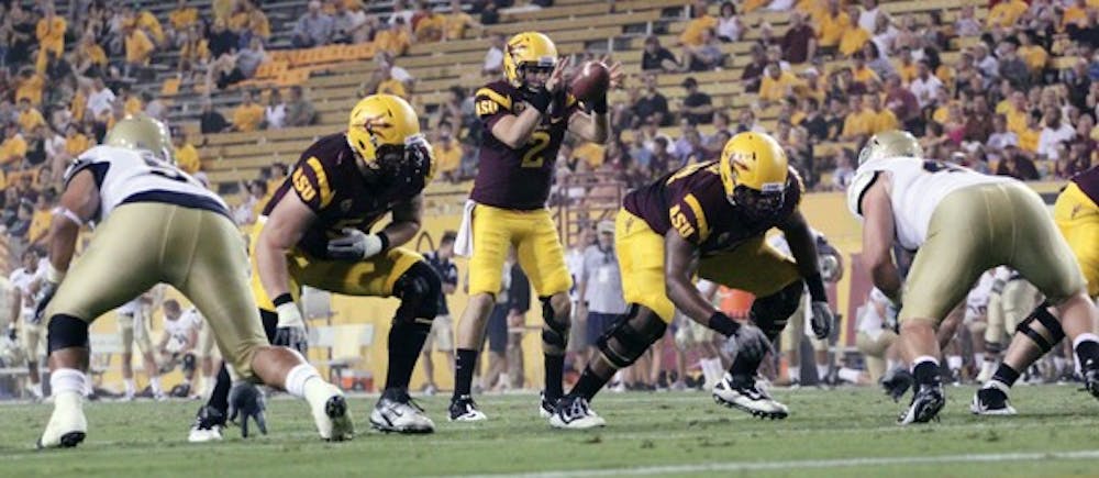 FRIEND TURNED FOE: Redshirt freshman backup quarterback Mike Bercovici receives the snap during the fourth quarter of the Sun Devils’ 48-14 win over UC Davis on Sept. 1. Bercovici will be reunited with his high school teammate, USC redshirt freshman D.J. Morgan, when ASU faces off against the Trojans on Saturday. (Photo by Beth Easterbrook)
