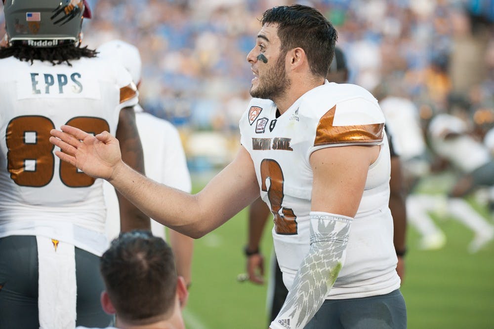 Redshirt senior quarter back Mike Bercovici (2) talks to his team at the end of the second quarter in a game against UCLA on Saturday, Oct. 3, 2015, at Rose Bowl Stadium in Pasadena, Calif..