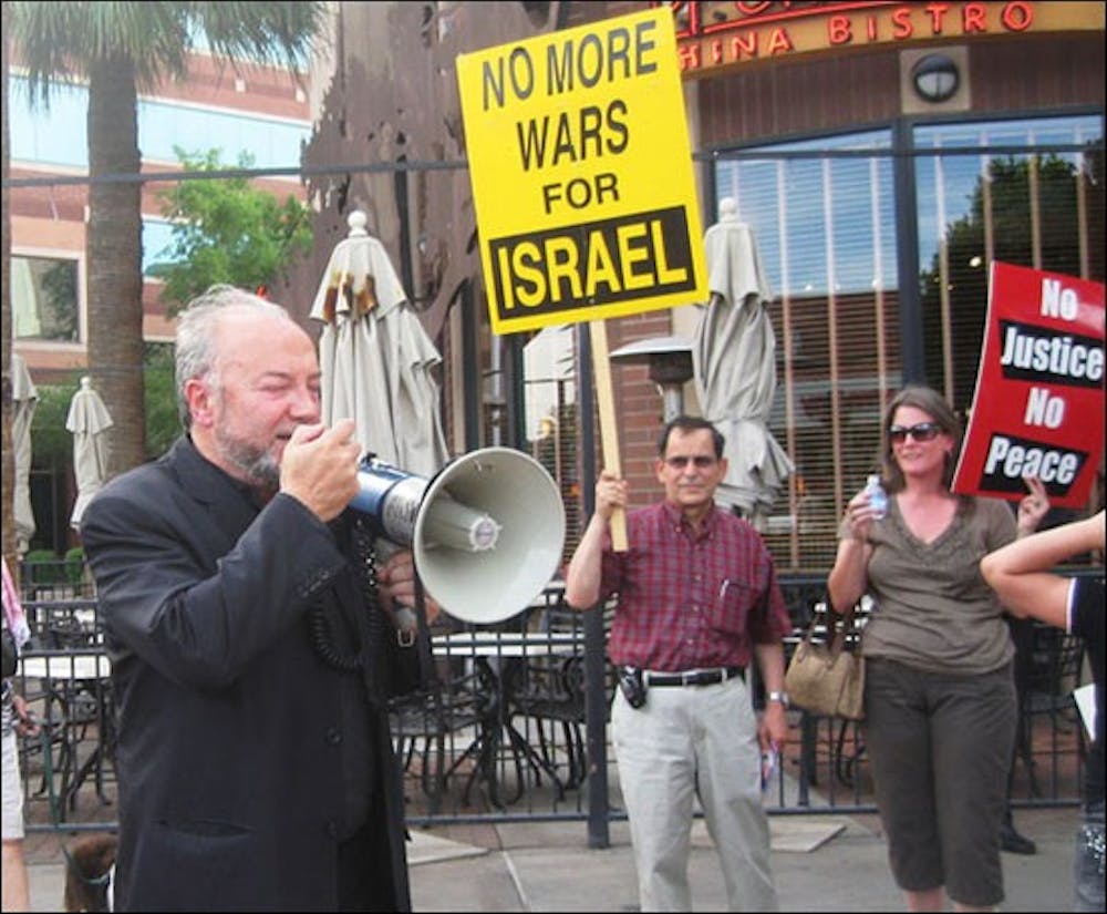 WAR AND PEACE: George Galloway, former member of the British Parliament speaks at  June 1st protest against Israeli flotilla raids. The protest was hosted by the ASU Coalition for Human Rights. (Photo courtesy of CODEPINK Arizona)