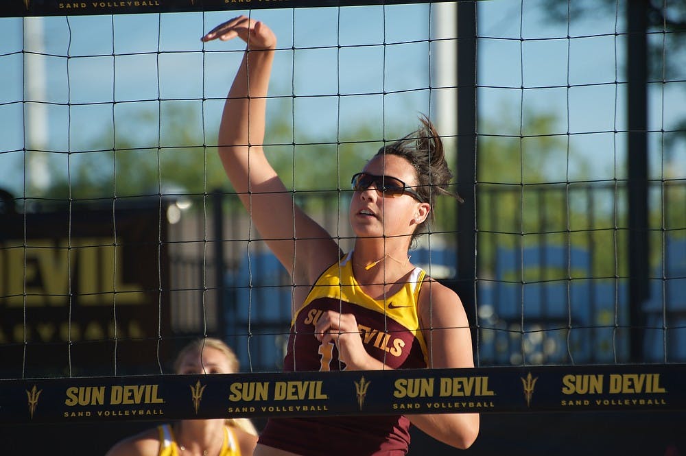 Junior Whitney Follete returns the ball against New Mexico, Saturday, March 28, 2015 at the PERA Athletic Club in Tempe. (Ben Moffat/The State Press)