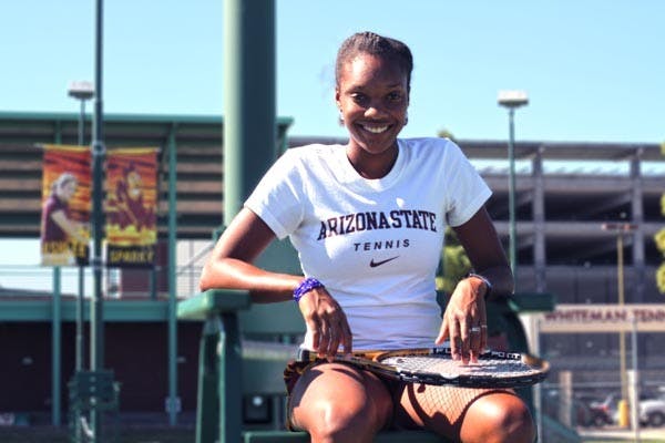 DOWN THE MIDDLE: Sophomore midfielder Taylor McCarter dribbles between two Washington defenders during Sunday's game. Despite a 1-0 loss, ASU coach Kevin Boyd said the team played its best possession game all year. 