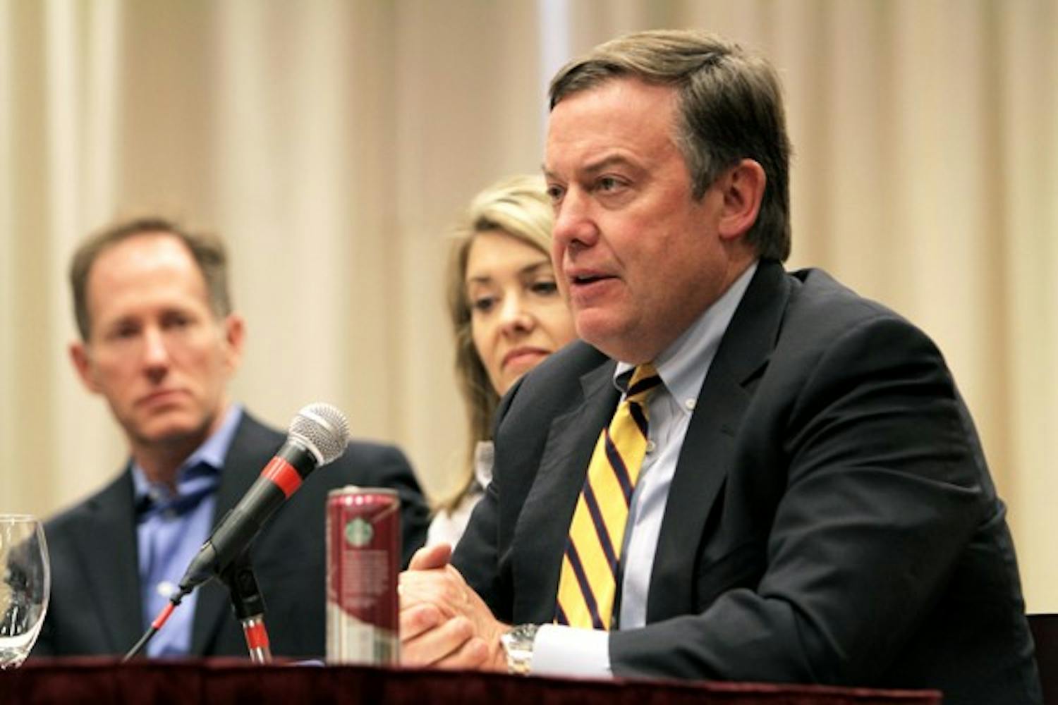 President Michael Crow speaks at a hearing about the proposed 3 percent tuition increase for ASU students next year. (Photo by Sean Logan)