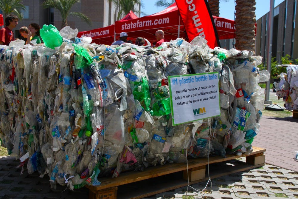 GREEN GUESSING: Diamondbacks tickets were offered to the student who could guess the correct number of recycled bottles in a massive bundle at the Earth Day festival. (Photo by Rosie Gochnour)