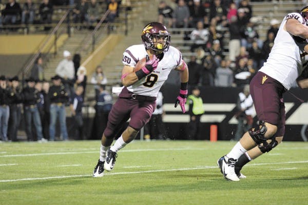Freshman running back D.J. Foster runs out of the backfield during the Sun Devils' 51-17 win over Colorado on Oct. 11. (Photo by Kyle Newman)