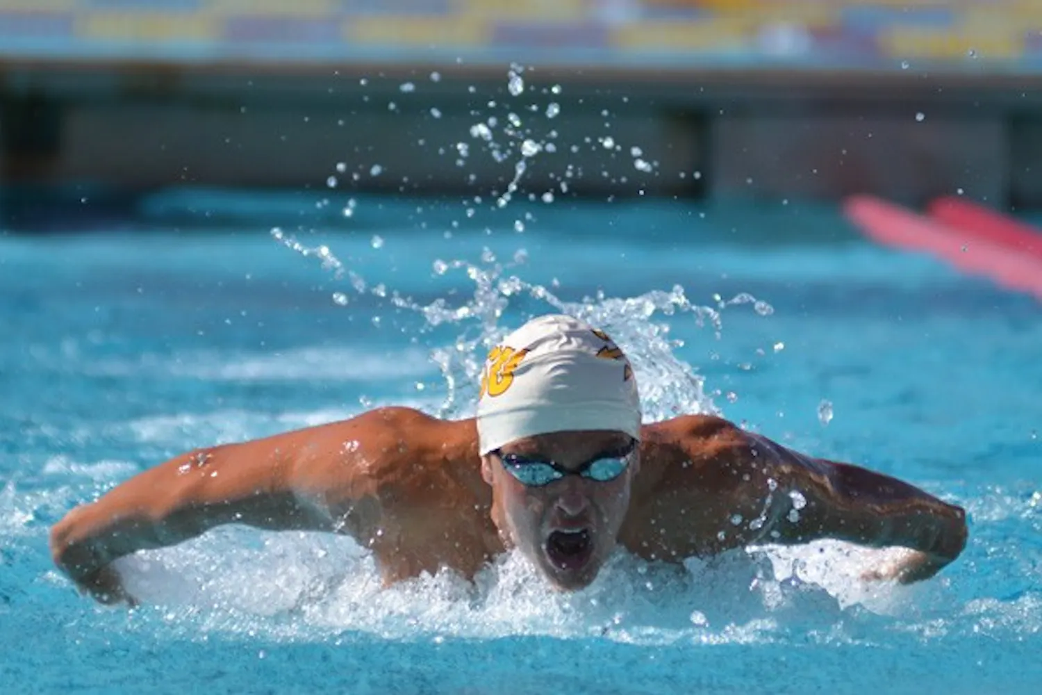 Redshirt senior Alicia Brightwell lifts her right arm with the ball ready to strike against on April 14, 2012. Brightwell and the rest of the ASU water polo team dominated UCSD 10-4 on Feb. 9. (Photo by Aaron Lavinsky)