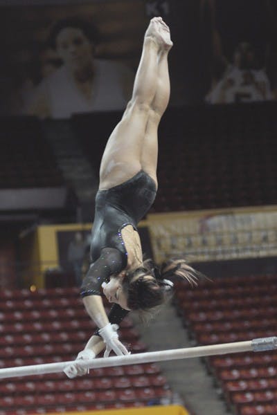 Strictly Vertical: ASU junior Stephanie Hangartner works on the bars, where she scored a 9.800, during the Sun Devils’ victory over Washington on Feb. 18. ASU will try to upset No. 2 Stanford on Sunday. (Photo by Sierra Smith)