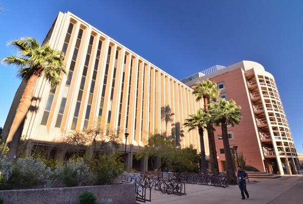 RESOURCE CUTS: The C and E wings of the Tempe campus life sciences buildings are seen towering above Hayden Mall on Monday afternoon. A number of science student's resources will be cut next year despite a potential $800 per-student annual fee. (Photo by Aaron Lavinsky)