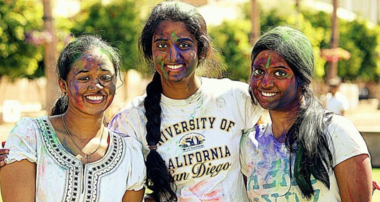 ASU students (from left) Nimisha Joseph, Divya Geetha Nair and Trupti Nair are covered in paint during Holi, the Hindu festival of colors, on March 10. Participants smear paint, powder and dyes all over one another to celebrate the arrival of spring. (Photo courtesy of Anand Aravamudhan)