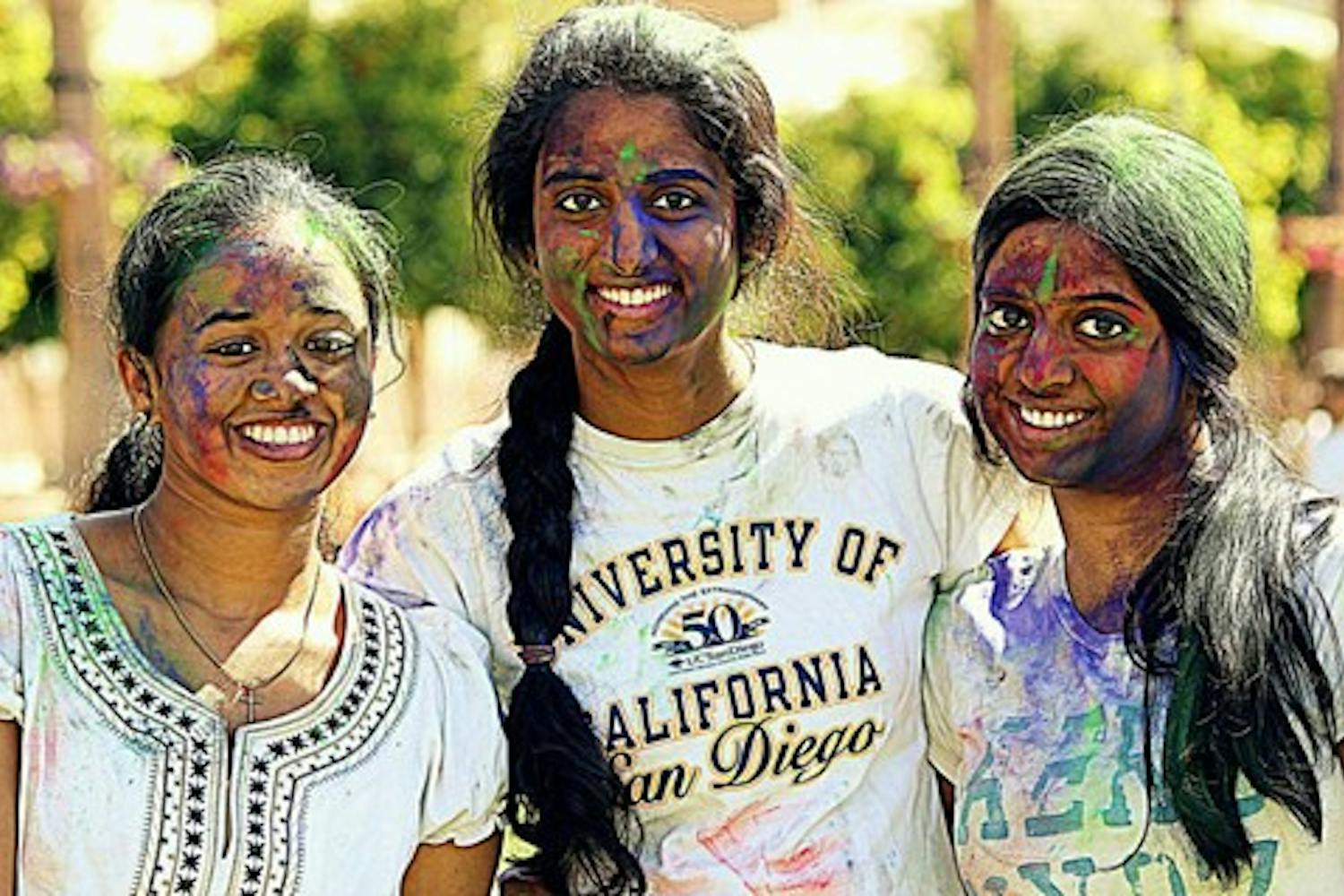 ASU students (from left) Nimisha Joseph, Divya Geetha Nair and Trupti Nair are covered in paint during Holi, the Hindu festival of colors, on March 10. Participants smear paint, powder and dyes all over one another to celebrate the arrival of spring. (Photo courtesy of Anand Aravamudhan)