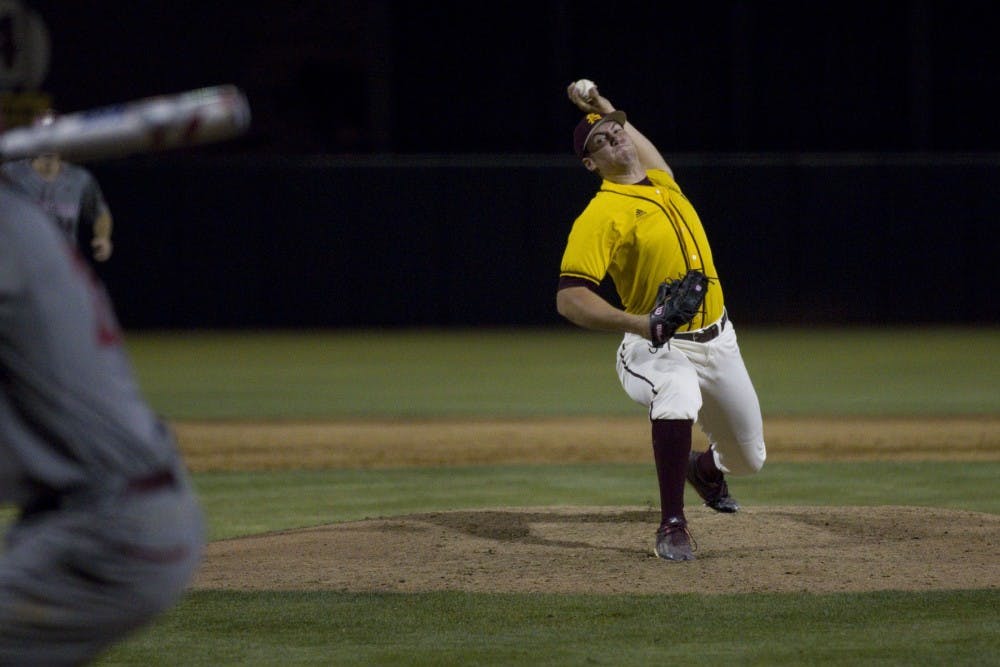 ASU sophomore pitcher Connor Higgins (11) tries to throw a strike during game one of a three game baseball series versus the Washington State Cougars at Phoenix Municipal Stadium in Phoenix on Thursday, April 13, 2017. ASU won 6-5.