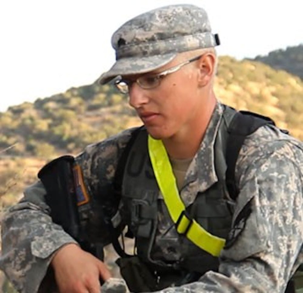 Junior Mike Winters catches his breath after completing the land navigation exercise at Fort Huachuca, Arizona.