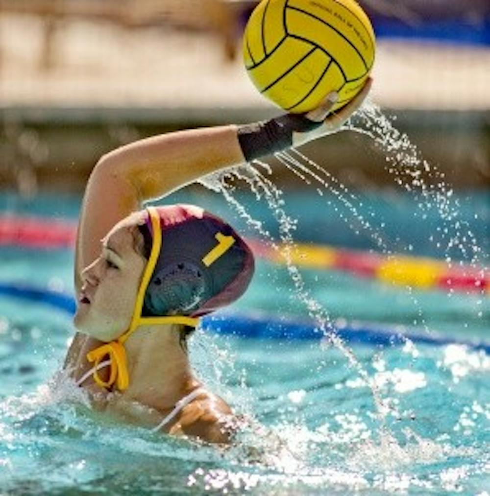 ASU women's water polo player Ianeta Hutchinson throws the ball during practice at the Mona Plummer Aquatic Center.  Photo by Tom Tingle/The Arizona Republic.