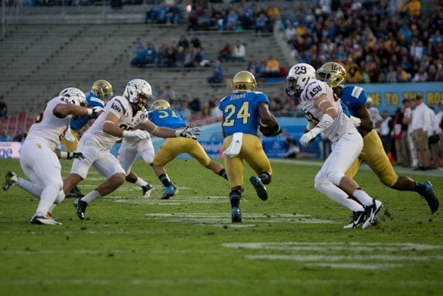 Sophomore cornerback Ishmael Adams takes the ball up the field against the Sun Devils in Pasadena, Calif. The Sun Devils defeated the Bruins 38-35 Saturday, Nov. 23. (Photo by Dominic Valente)