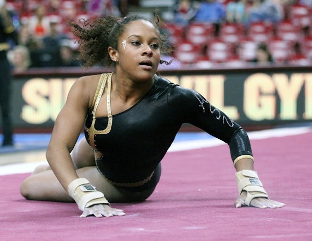 Senior Beaté Jones performs a floor routine in a meet against Illinois on Feb. 19. Jones placed second in the all-around and tied a career high 9.900 in the floor exercise event. (Photo by Beth Easterbrook)