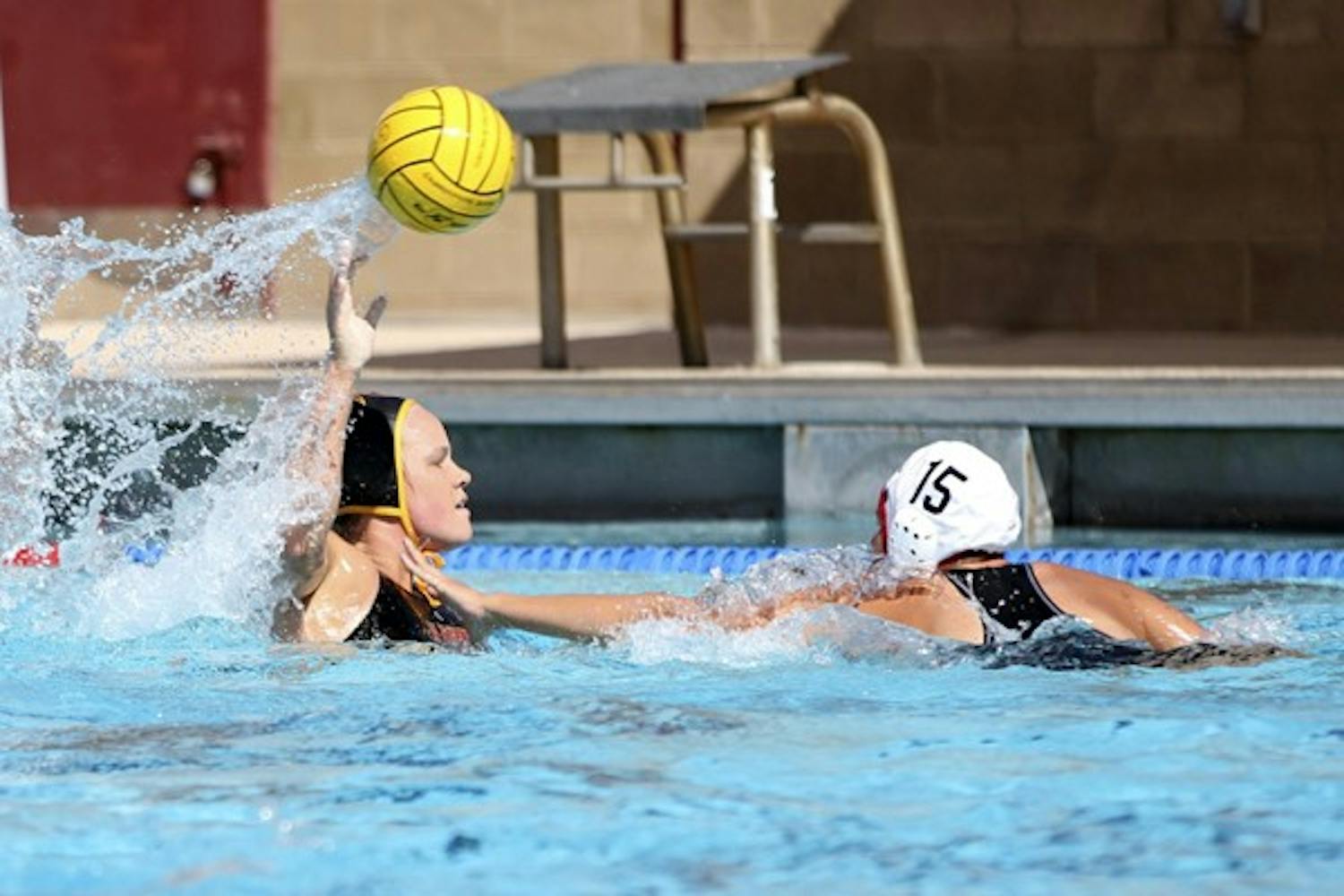 READY, AIM, FIRE: Sophomore attacker Kelsy White prepares to fire a shot on net during a practice earlier this year. The water polo team will begin conference play this weekend against UCLA. (Photo by Serwaa Adu-Tutu)