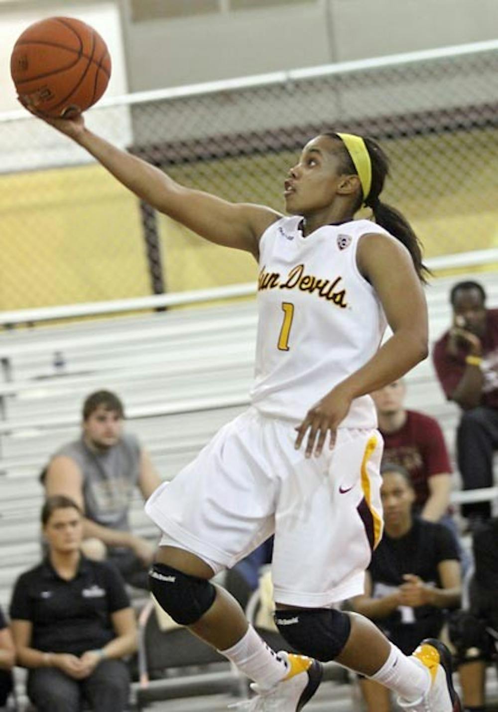 FITTING IN: Redshirt senior guard Dymond Simon takes the ball to the hoop during ASU's Nov. 26 win over Providence. After a year away from the court with an ACL injury, Simon has had to tailor her game to a new offensive system and new teammates. (Photo Courtesy of Steve Rodriguez)