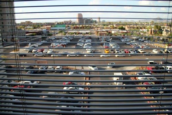 Blinds cut through the view of downtown Phoenix from a window in the Cronkite School building Wednesday afternoon. (Photo by Diana Lustig)