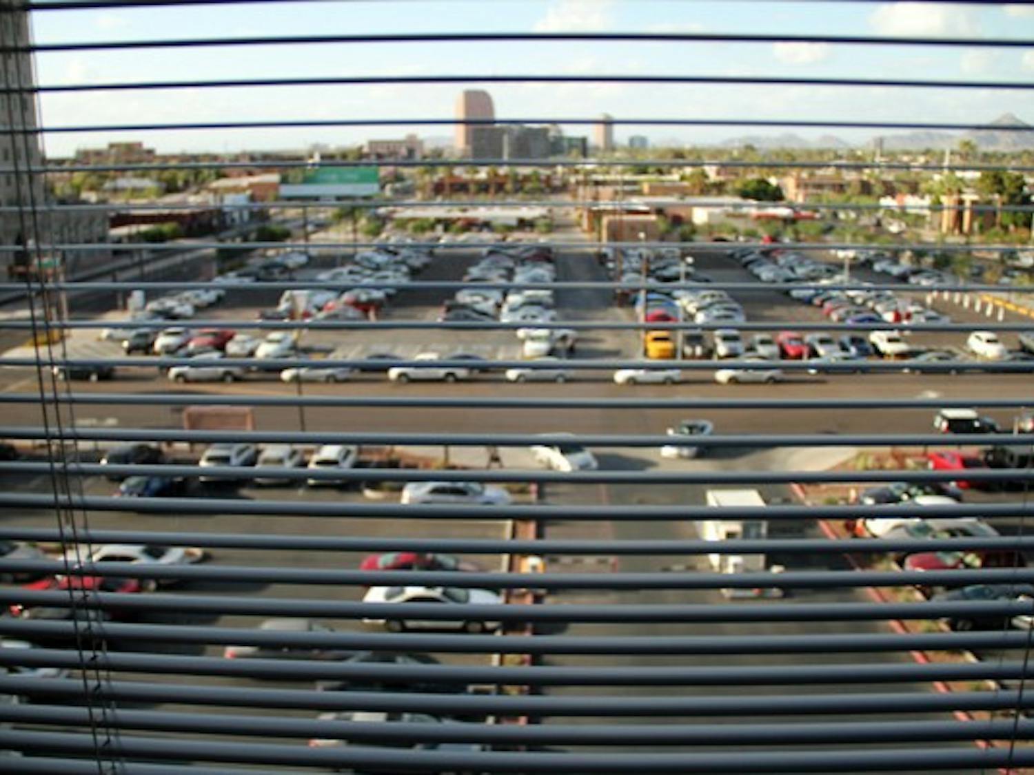 Blinds cut through the view of downtown Phoenix from a window in the Cronkite School building Wednesday afternoon. (Photo by Diana Lustig)