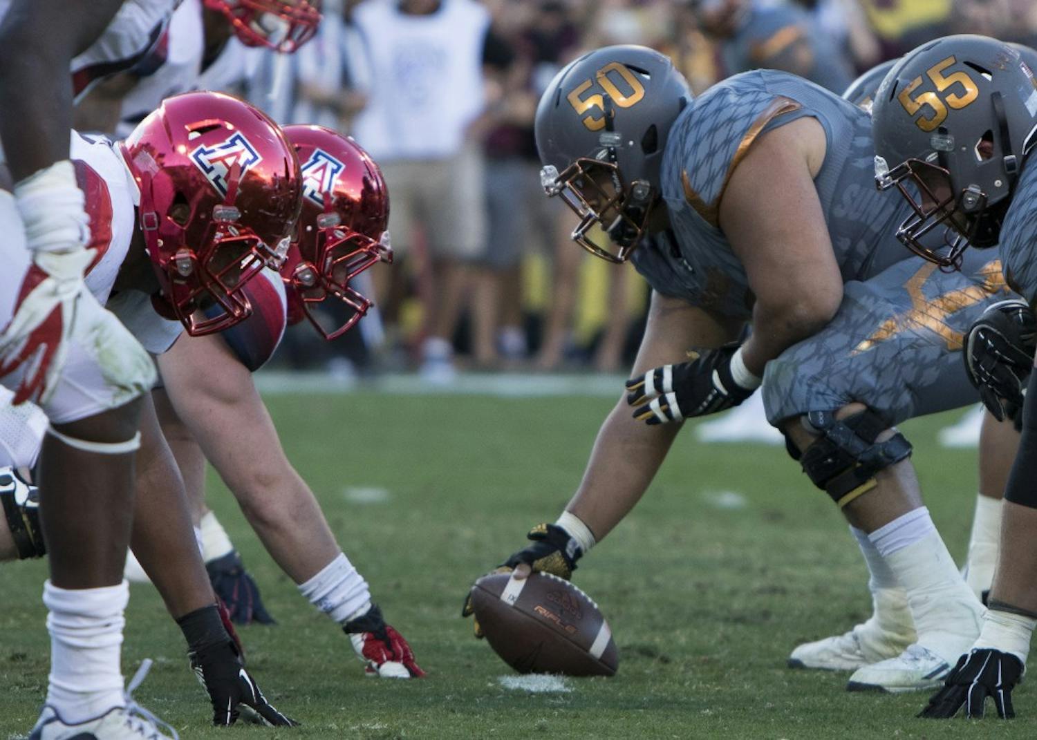 Senior offensive lineman Nick Kelly (50) gets ready to snap the ball in the fourth quarter against UA on Saturday, Nov. 21, 2015, at Sun Devil Stadium  in Tempe. The Sun Devils defeated the Wildcats 52-37. 