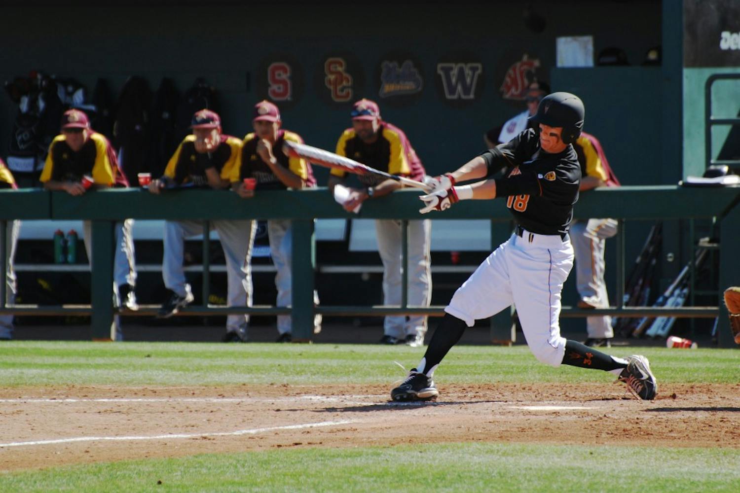 Freshman outfielder Johnny Sewald follows through on a swing against Bethune-Cookman on Feb. 17. The ASU baseball team won their first series of the season over the Wildcats 2-1. (Photo by Murphy Bannerman)