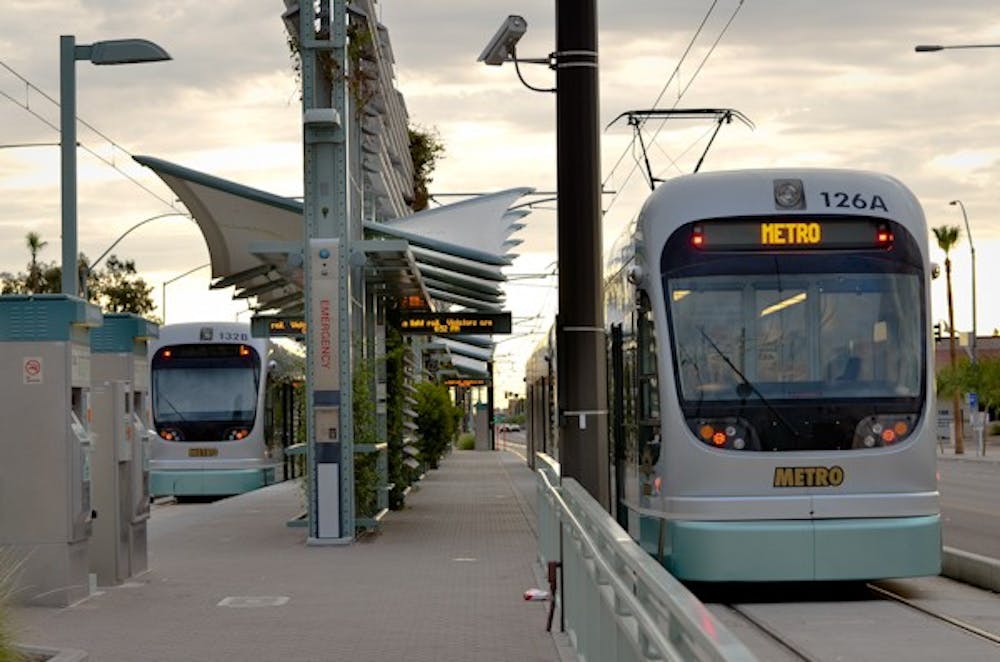 END OF THE LINE: Trains prepare to depart from the last stop on the METRO Light rail line at Sycamore and Main Street in Mesa. After receiving a Finding of No Significant Impact from the Federal Transit Administration, METRO will be expanding the light rail line further into Mesa. (Photo by Aaron Lavinsky