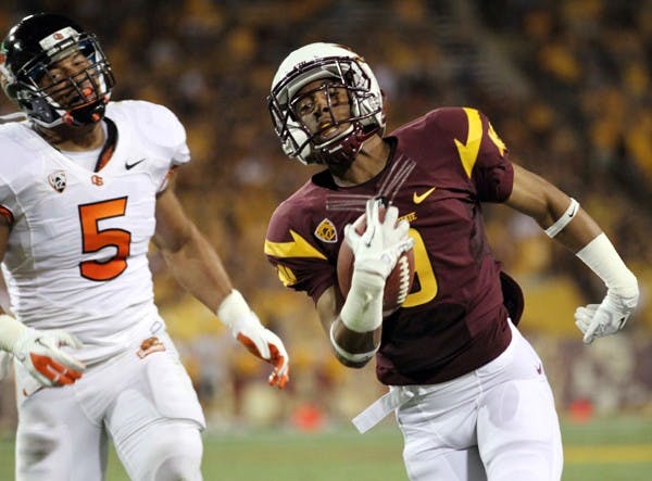 PULLING AWAY: Junior wide receiver A.J. Pickens sprints from OSU senior linebacker Cameron Collins for a touchdown during the second quarter of the Sun Devils’ 35-20 win over the Beavers on Saturday. (Photo by Lisa Bartoli)