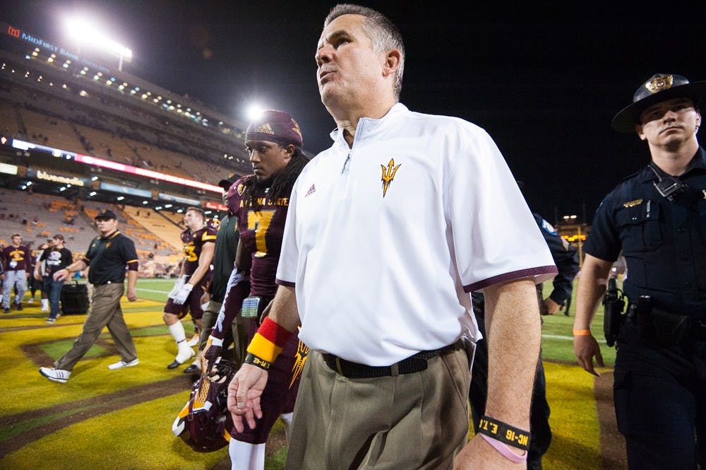 Head coach Todd Graham (right) walks off the field with Redshirt senior defensive back Solomon Means (7) after losing to USC on Saturday, Sept. 26, 2015, at Sun Devil Stadium in Tempe. The Trojans defeated the Sun Devils 42-14.