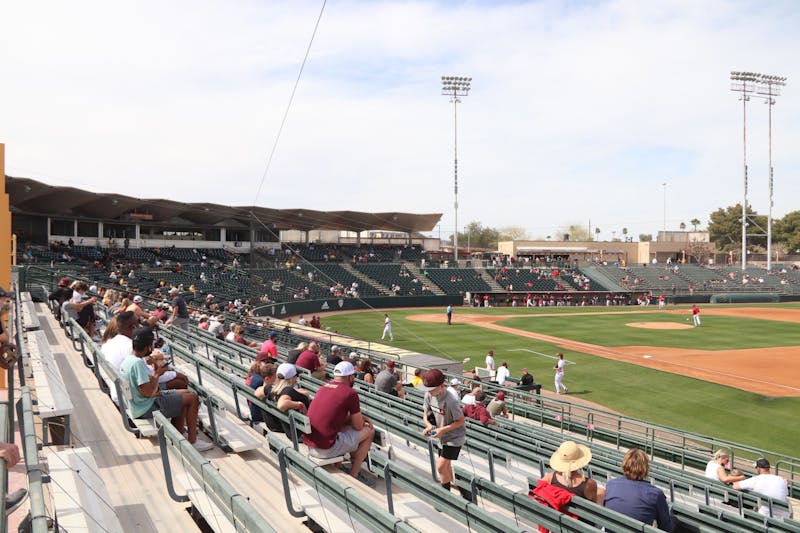 Socially distanced fans watch an ASU baseball game at Phoenix Municipal Stadium on Sunday, March 7, 2021.&nbsp;