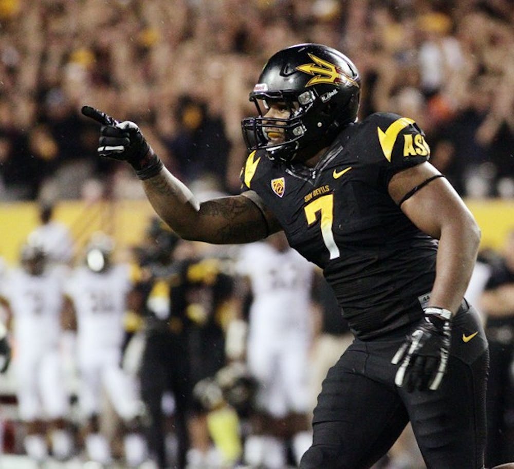 HOLDING THE CARDS: ASU junior linebacker Vontaze Burfict points to the Sun Devil sideline after a sack against Mizzou earlier in the season. ASU appears to hold a solid advantage over visiting Colorado. (Photo by Beth Easterbrook)