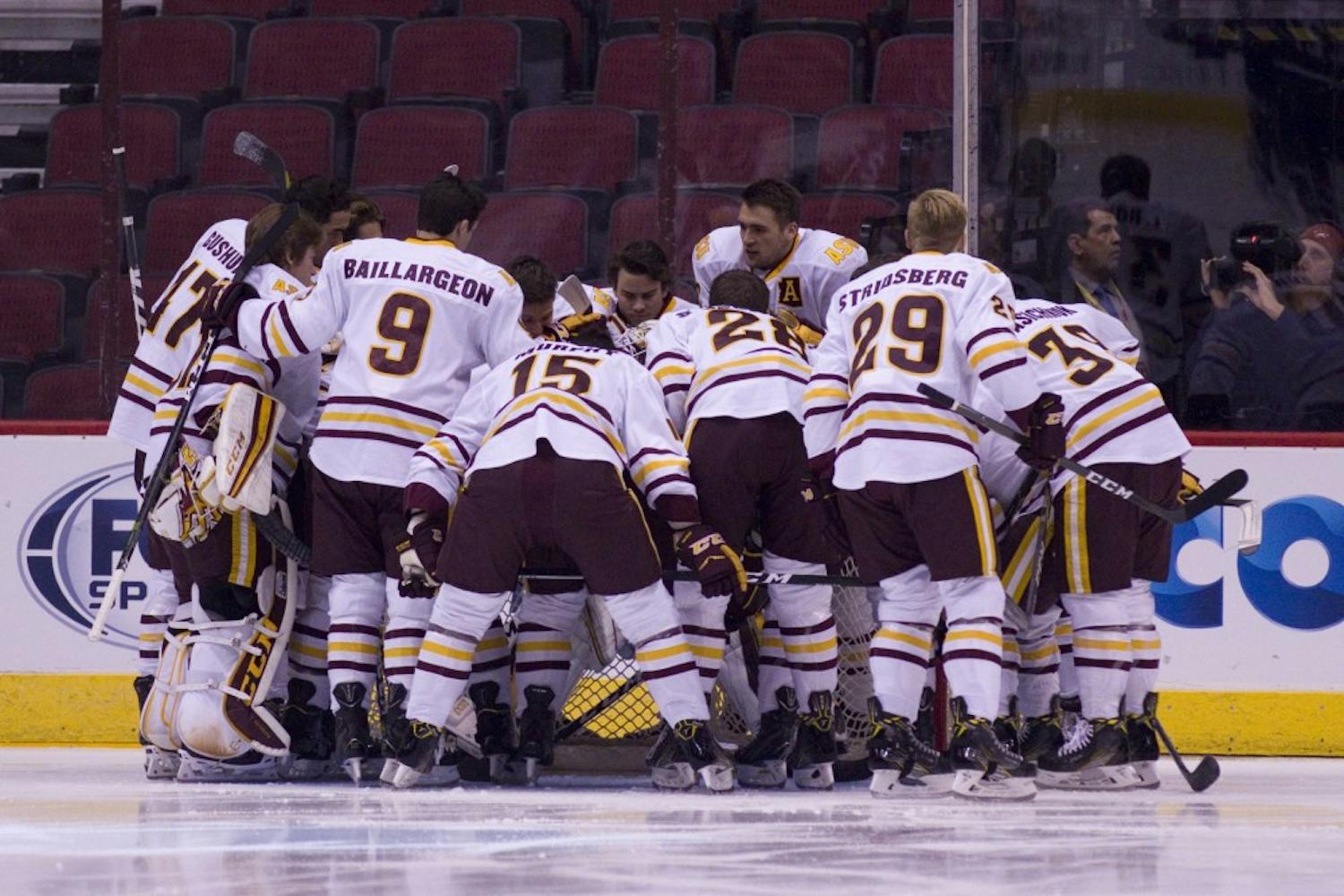 The ASU men's hockey team huddles up before a 5-2 victory against Air Force in Gila River Arena in Glendale, Arizona, on Sunday, Oct. 16, 2016.