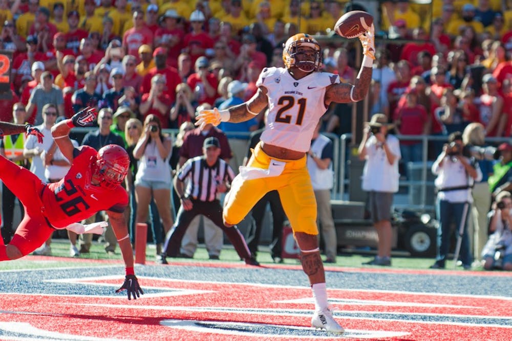 Redshirt junior wide receiver Jaelen Strong pulls in a three-yard touchdown catch in the second quarter a game against the University of Arizona, Friday, Nov. 28, 2014 at Arizona Stadium in Tucson. The Wildcats defeated the Sun Devils 42-35. (Photo by Ben Moffat)