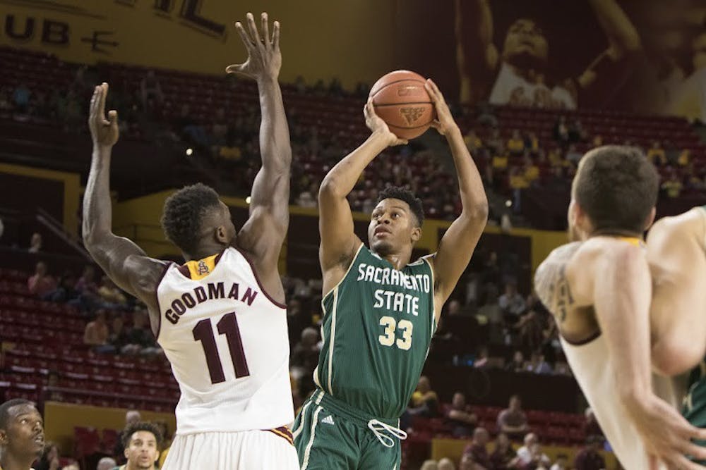 Junior forward Savon Goodman (11) attempts to block a shot in the first half against Sacramento State on Friday, Nov. 13, 2015, at Wells Fargo Arena in Tempe. The Hornets defeated the Sun Devils 66-63.