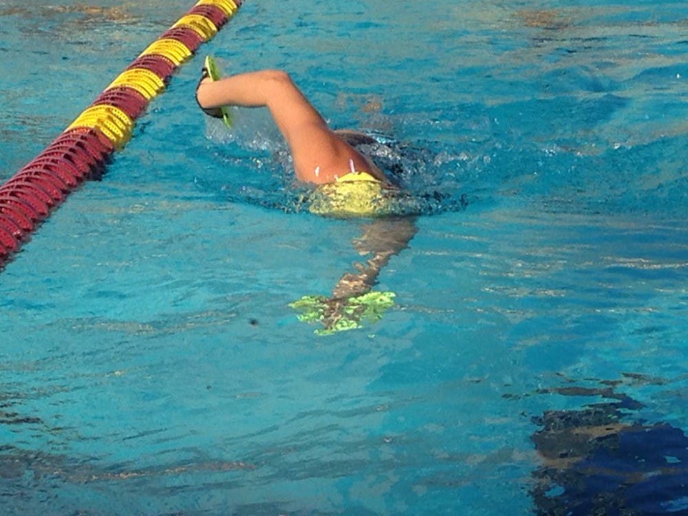 ASU senior Alysha Bush practices her freestyle tempo with paddles on Wednesday, Nov. 30 at the Mona Plummer Aquatic Center.