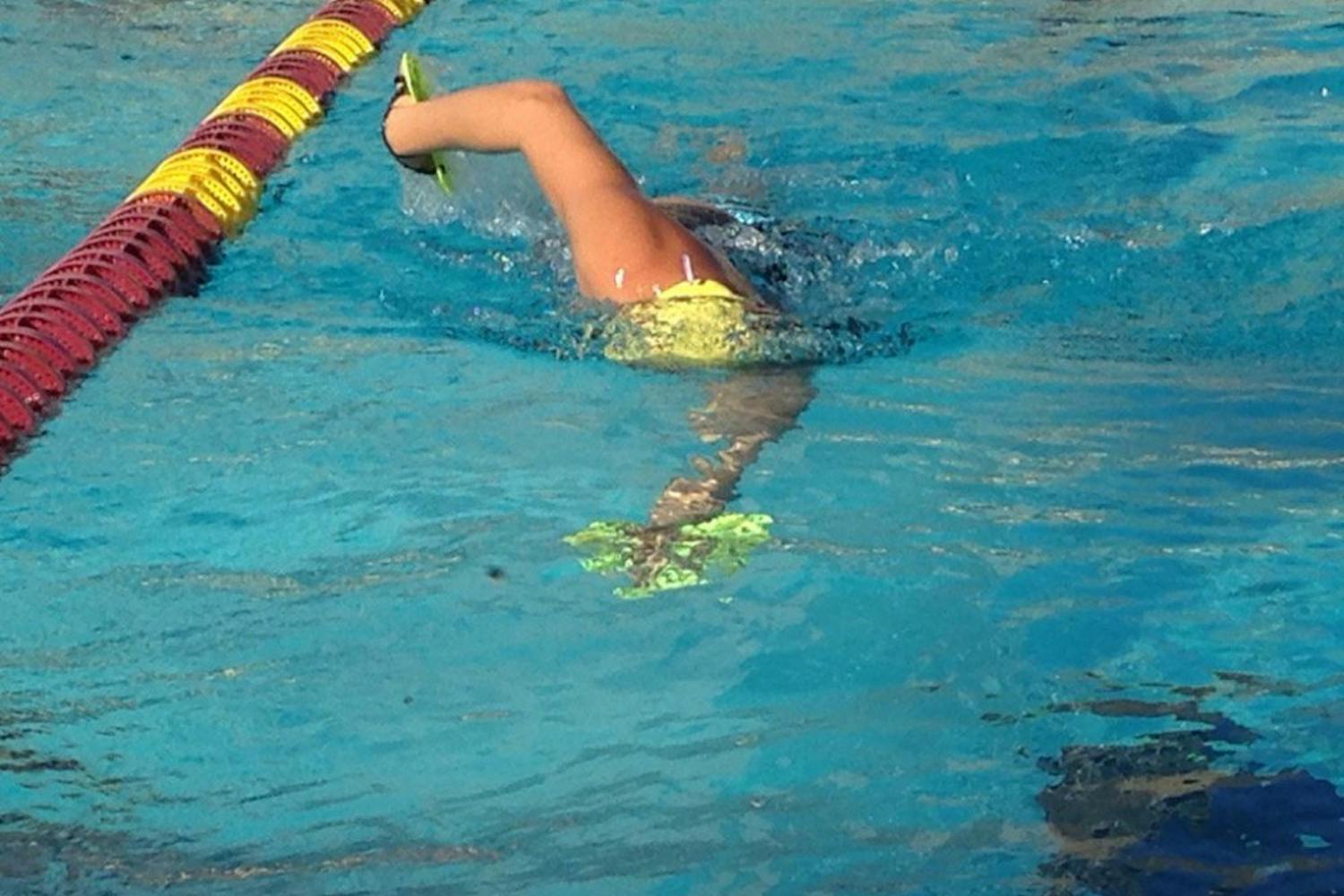ASU senior Alysha Bush practices her freestyle tempo with paddles on Wednesday, Nov. 30 at the Mona Plummer Aquatic Center.